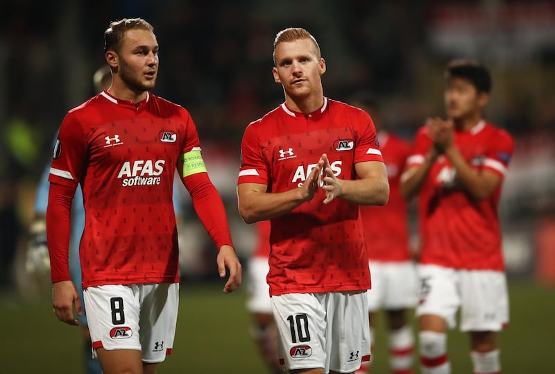 Teun Koopmeiners, left, and Dani de Wit of AZ Alkmaar applaud fans following their Europa League match against Manchester United. Getty