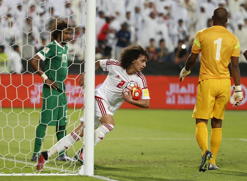 UAE’s Omar Abdulrahman celebrates after scoring against Saudi Arabia during their World Cup 2018 Asian qualifying football match on March 29, 2016 at the Mohammed Bin Zayed Stadium in Abu Dhabi. / AFP / KARIM SAHIB