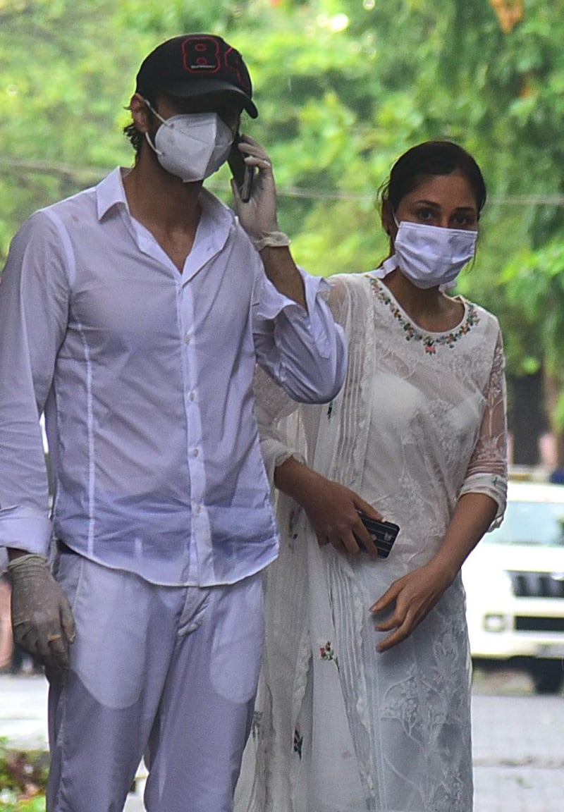 Bollywood actress Pooja Chopra, right, arrives to attend the funeral of Sushant Singh Rajput in Mumbai on June 15, 2020. AFP