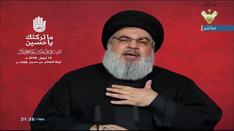 epa07033287 A tv grab handout photo from Hezbollah's al-Manar TV shows Hezbollah leader Sayed Hassan Nasrallah giving a televised address during the tenth night of the month of Muharram (Ashura) in Southern suburb of Beirut, Lebanon, 19 September 2018. Nasrallah spoke about the situations in Lebanon and the Arabic countries like Syria and Yemen. Shiite Muslims across the world are observing Muharram, the first month of the Islamic calendar. The climax of Muharram is the Ashura festival commemorating the martyrdom of Imam Hussein, a grandson of the Prophet Mohammed in the Iraqi city of Karbala in the seventh century.  EPA/AL-MANAR TV GRAB / HANDOUT  HANDOUT EDITORIAL USE ONLY/NO SALES