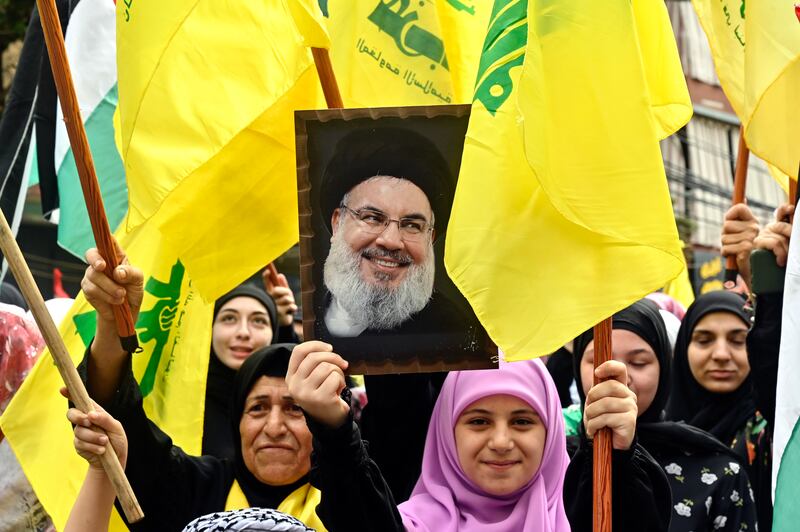 Supporters of Hezbollah carry a portrait of leader Hassan Nasrallah during a rally in Beirut to express solidarity with Palestinians in the Gaza Strip. EPA
