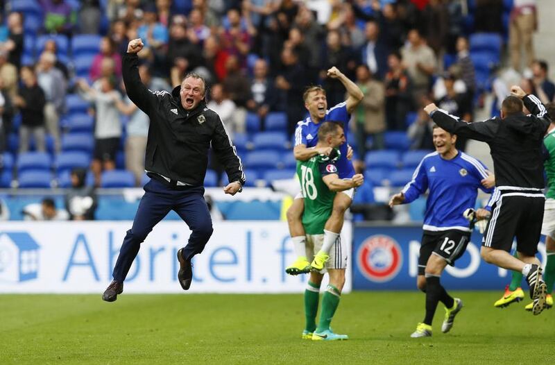 Northern Ireland manager Michael O’Neill celebrates after Northern Ireland’s Niall McGinn scores their second goal. Jason Cairnduff / Reuters