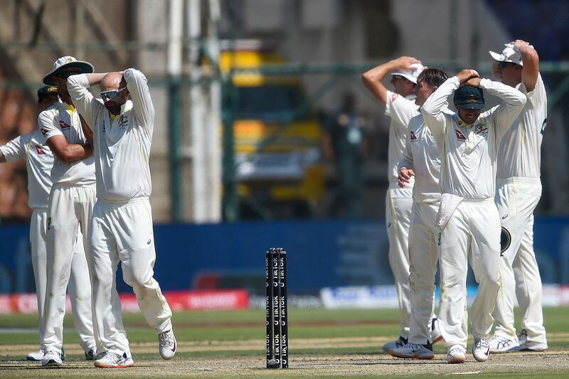 Australia's players react after an unsuccessful appeal against Pakistan's Babar Azam. AFP