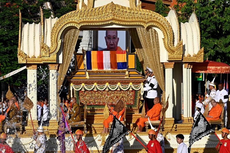 The coffin of Tep Vong, the leader of Cambodia's Buddhist community, sits on a golden dragon float during a funeral procession before his cremation in Phnom Penh. AFP