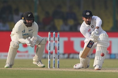 India's Shreyas Iyer plays a defensive shot during the day one of their first test cricket match with New Zealand in Kanpur, India, Thursday, Nov.  25, 2021.  (AP Photo / Altaf Qadri)