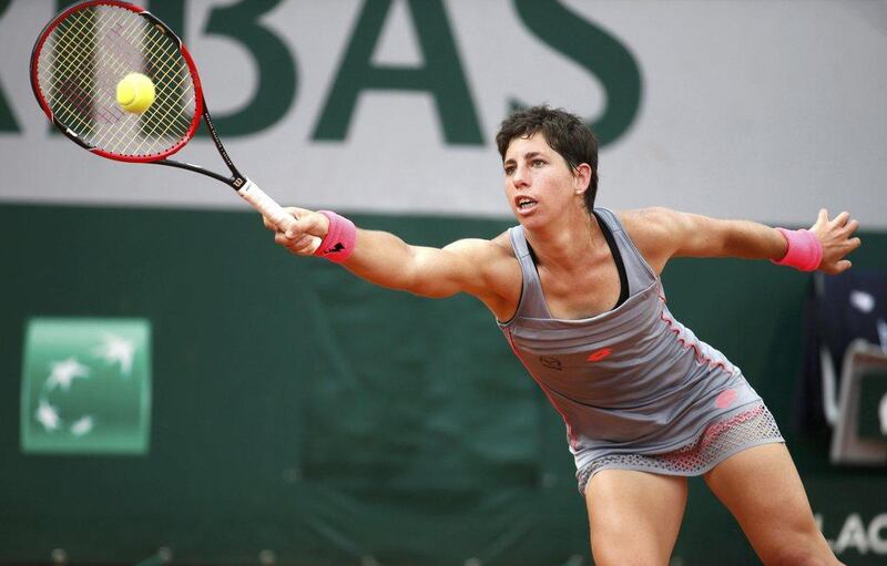 Carla Suarez Navarro of Spain plays a shot to Monica Niculescu of Romania during their women's singles match at the French Open tennis tournament at the Roland Garros stadium in Paris, France, May 25, 2015. REUTERS/Vincent Kessler