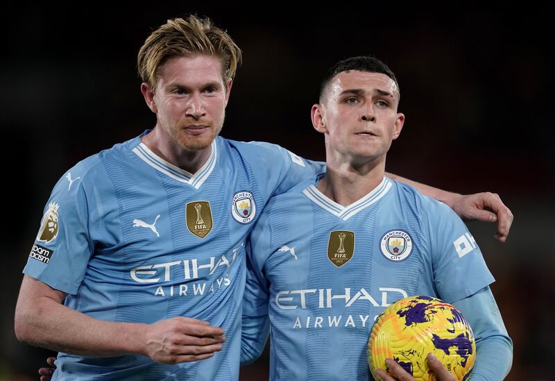 Manchester City's Kevin De Bruyne and Phil Foden celebrate their win at the Gtech Community Stadium. PA
