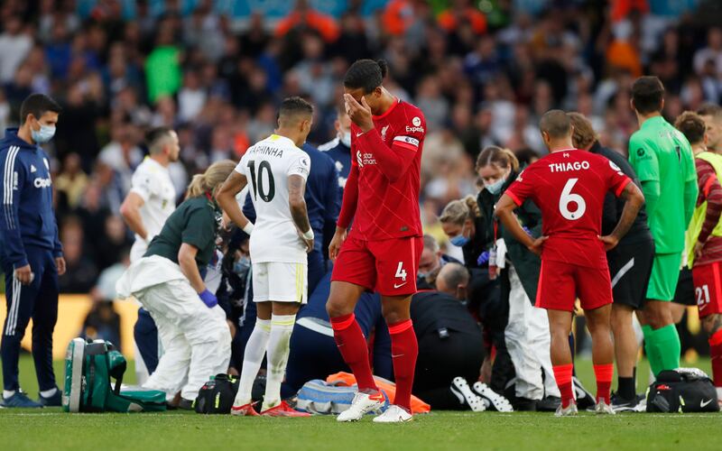 A distressed Virgil van Dijk as teammate Harvey Elliott receives medical attention after sustaining a serious injury in gthe second half. Reuters