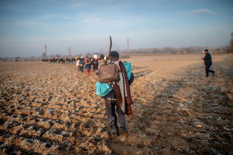 A migrant walk towards the Greek border in Pazarkule, in the Edirne district. AFP