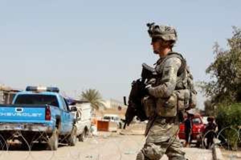 A US soldier patrols the area near the Independent High Electoral Commission (IHEC) headquarters in Baghdad on March 8, 2010, following Iraq's second general elections since the US-led invasion of 2003. Iraqi Prime Minister Nuri al-Maliki, the Shiite leader who helped ease Iraq's deadly sectarian conflict, emerged as a front-runner after the March 7 election, seen as a test of the nation's young democracy. AFP PHOTO/AHMAD AL-RUBAYE