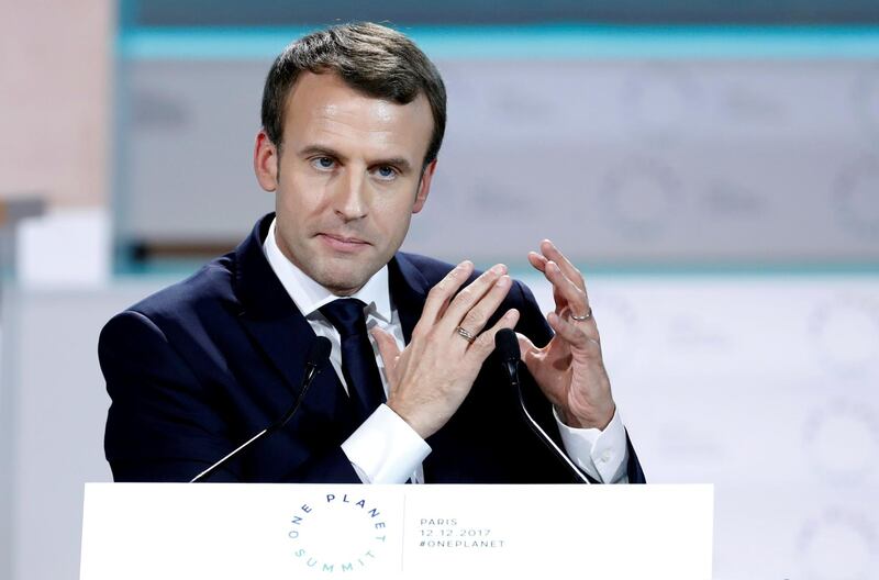 FILE PHOTO: French President Emmanuel Macron delivers the closing speech the Plenary Session of the One Planet Summit at the Seine Musicale event site on the Ile Seguin in Boulogne-Billancourt, near Paris, France, December 12, 2017. REUTERS/Etienne Laurent/File Photo