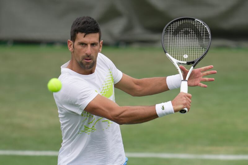 Novak Djokovic on the practice court as the defending champion aims to win his eighth Wimbledon title. AP