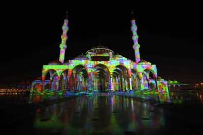 Sharjah Mosque is lit up in a colourful display for the 11th annual Sharjah Light Festival in the emirate of Sharjah on February 10, 2022. (Photo by Giuseppe CACACE / AFP)