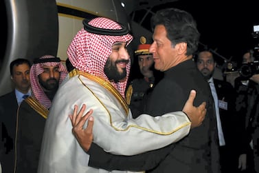 Pakistan's Prime Minister Imran Khan greets Saudi Crown Prince Mohammed bin Salman. AFP 