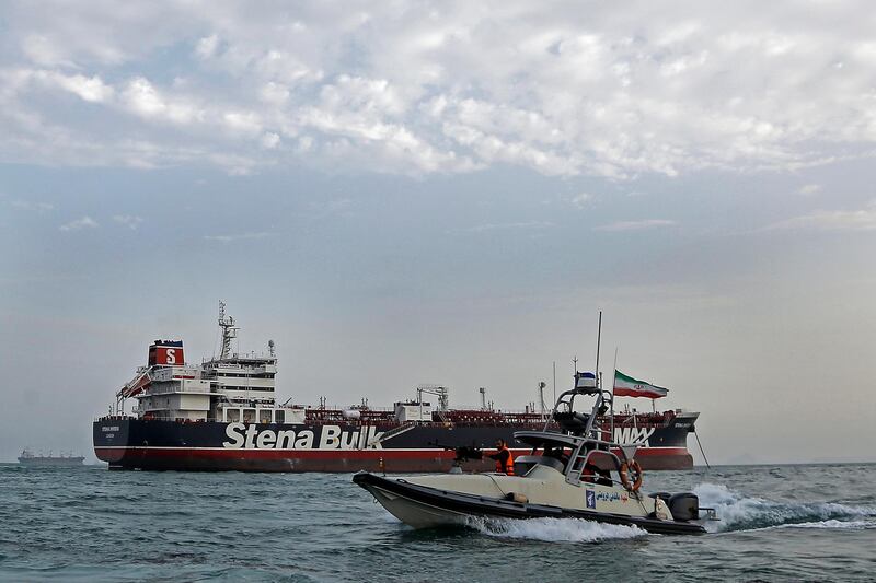 epa07743791 (FILE) - An Iranian Revolutionary Guard jet boat sails around the seized British-flagged tanker Stena Impero in Bandar Abbas, southern Iran, 21 July 2019 (reissued 27 July 2019). Reports on 27 July 2019 state three Russian crew members aboard Stena Impero have been visited by Russia's Iran embassy representatives. The embassy is efforting their release, reports state.  EPA/HASAN SHIRVANI