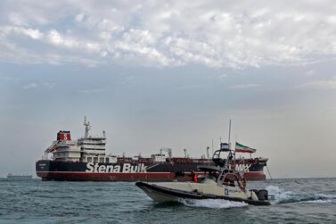 An Iranian Revolutionary Guard jet boat sails around the seized British-flagged tanker Stena Impero. EPA