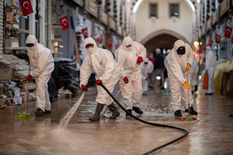 Fatih Municipality workers disinfect the Egyptian Bazaar before reopening in Istanbul, Turkey. EPA