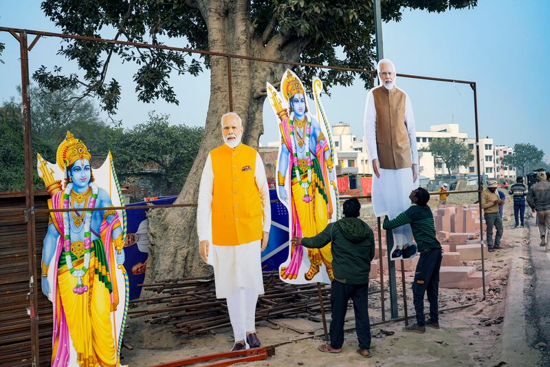 Workers put up cutouts of Hindu deity Ram and Indian Prime Minister Narendra Modi in Ayodhya, India. AP Photo