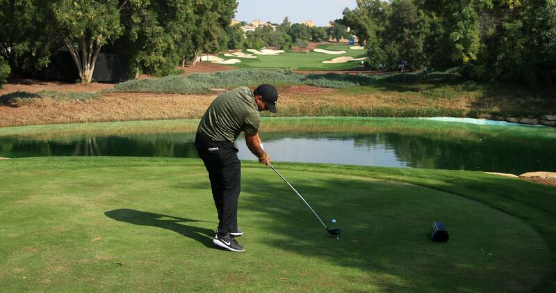 Patrick Reed tees off on the seventh hole during day one of the DP World Tour Championship. Getty