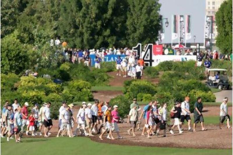 Fans follow Lee Westwood during the second round of the Dubai World Championship.