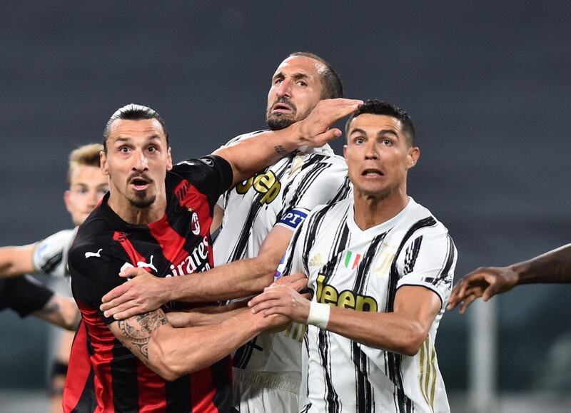 AC Milan's Zlatan Ibrahimovic battles with Cristiano Ronaldo and Giorgio Chiellini of Juve. Reuters