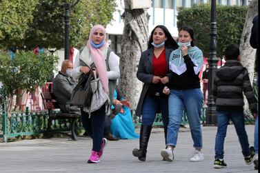 Women walk on Habib Bourguiba avenue in Tunis. Tunisia's fiscal deficit is estimated to have widened to 11.5 per cent of GDP in 2020. Photo: EPA