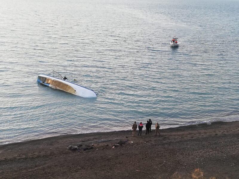 VAN, TURKEY - DECEMBER 26: Officials wait at shore of Van Lake after a boat carrying irregular migrants sank on December 26, 2019 in Van, Turkey. 7 irregular migrants lost their lives and 64 of them rescued by officials.

 (Photo by Harun Nacar/Anadolu Agency via Getty Images)