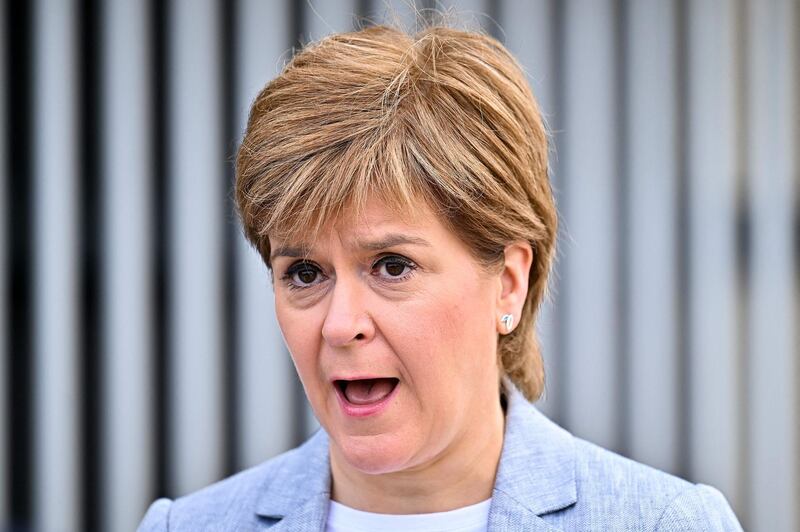 Scotland's First Minister Nicola Sturgeon speaks to the media after receiving her second dose of the Oxford/AstraZeneca Covid-19 vaccine at the NHS Louisa Jordan vaccine centre on June 21, 2021 in Glasgow. / AFP / POOL / Jeff J Mitchell
