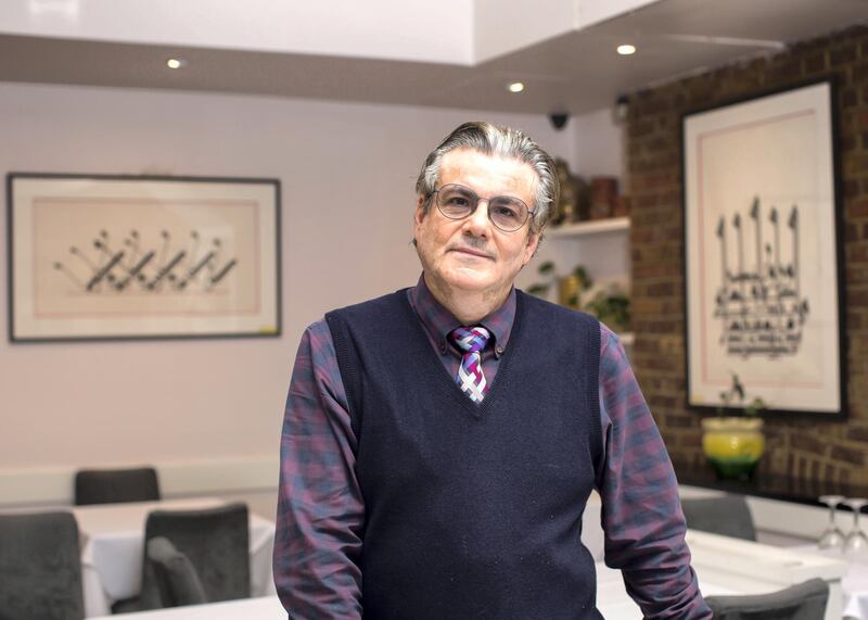 Mohammad Antabli, General Manager of Alwaha Restaurant in Westbourne Grove London. Photographed for TheNational. Calligraphy by Mouneer Al-Shaarani