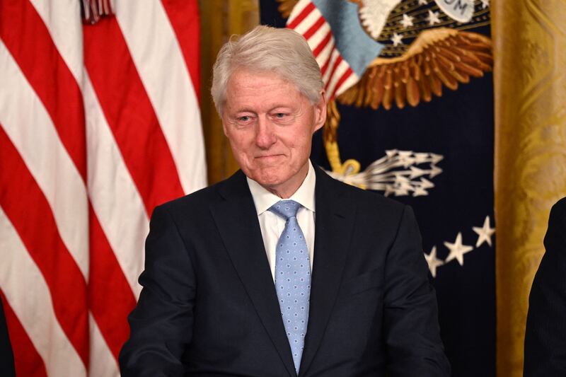 Mr Clinton's law entitles eligible employees of covered employers to take unpaid, job-protected leave for specified family and medical reasons, with continued insurance cover. AFP