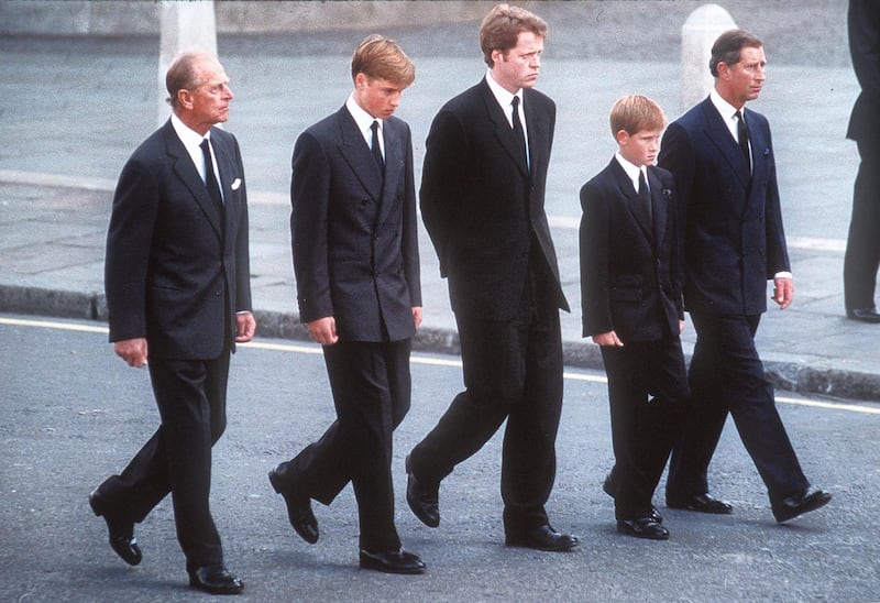 LONDON, ENGLAND - SPETEMBER 6:  (FILE PHOTO) Prince Philip, the Duke of Edinburgh, Prince William, Earl Spencer, Prince Harry and Prince Charles, the Prince of Wales follow the coffin of Diana, Princess of Wales this in September 6, 1997 file photo in London, England.  The funeral took place seven days after she was killed in an automobile accident in Paris. Members of the royal family walked in the procession behind the coffin, as did 500 representatives of the charities associated with the Princess.  At least a million people lined the streets of central London to watch the procession from Kensington Palace to Westminster Abbey.   (Photo by Anwar Hussein/Getty Images)