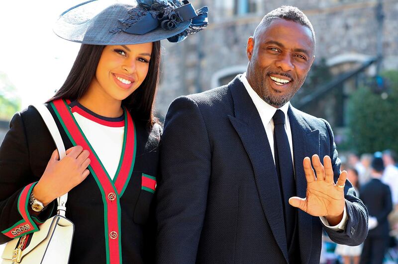 British actor Idris Elba arrives with his fiancee Sabrina Dhowre for the wedding ceremony of Britain's Prince Harry  and Meghan Markle at St George's Chapel, Windsor Castle, in Windsor. Gareth Fuller / AFP