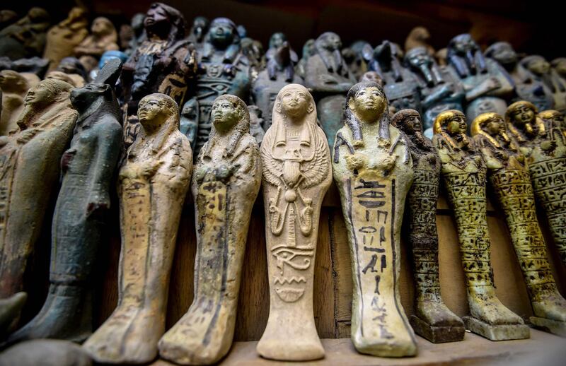 Miniature sarcophagi are on display at a shop in Luxor, Egypt. AFP