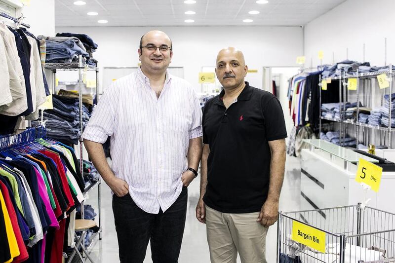Sibtain Malik and Waheed Nasir at the Light House used clothes outlet in Al Quoz, Dubai. Reem Mohammed / The National