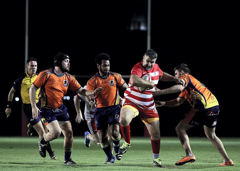 Sharjah, June, 01, 2018: RAK Rugby ( Red& White ) and  Arabian Knights ( Orange& BlacK) in action during the Nick Young Memorial match at the Sharjah Wanderers sports club in Sharjah . Satish Kumar for the National / Story by Paul Radley