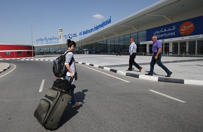 A passenger walks into Al Maktoum International Airport in Dubai. Ali Haider / EPA