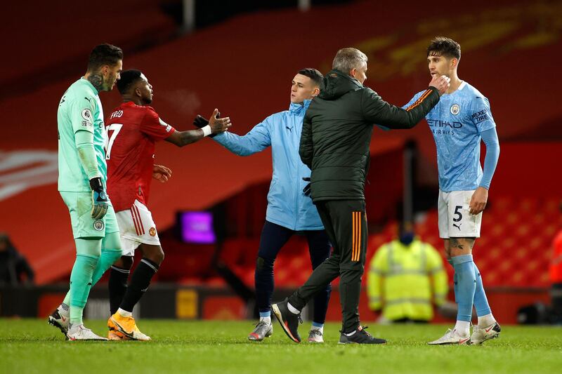 Solskjae  with Ederson,  John Stones and Phil Foden of Manchester City. Getty