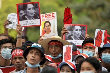 Demonstrators hold placards with pictures of Aung San Suu Kyi as they protest against the military coup in Yangon, Myanmar, this week. Reuters