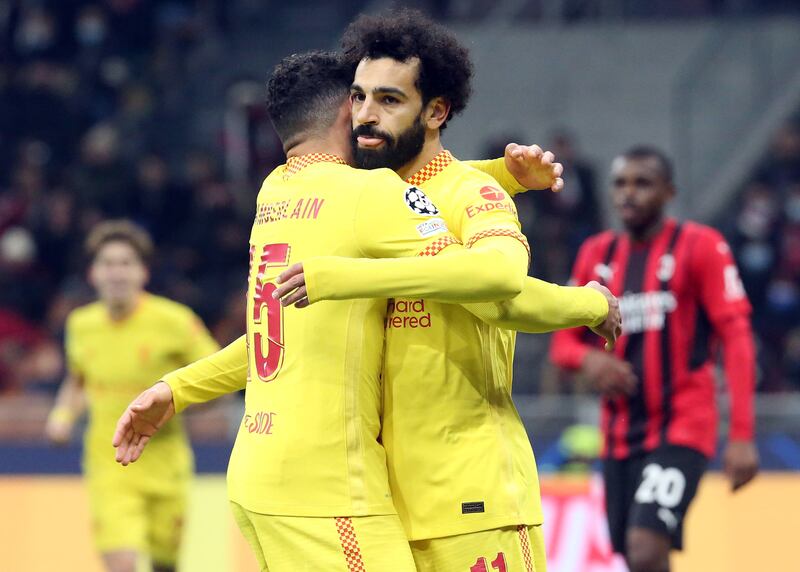 Liverpool's Mohamed Salah celebrates scoring the equalizer with his teammate Alex Oxlade-Chamberlain (L) during the UEFA Champions League group B soccer match between Ac Milan and Liverpool at Giuseppe Meazza stadium in Milan, Italy, 07 December 2021.   EPA / MATTEO BAZZI