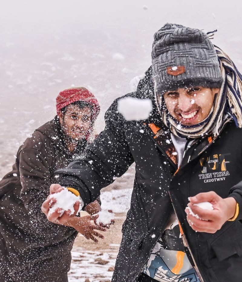 People play in the snow on Jebel Al Lawz (Mountain of Almonds), west of Saudi Arabia's city of Tabuk. All photos: AFP