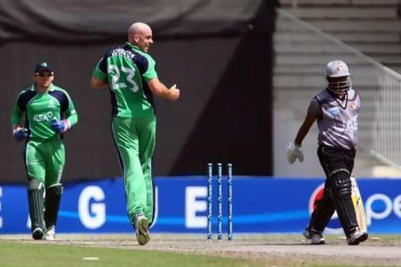 Ireland's Trent Johnson, right, rejoices after dismissing UAE's Swapnil Patil during the second ODI match at the Sharjah Cricket Stadium. Satish Kumar / The National