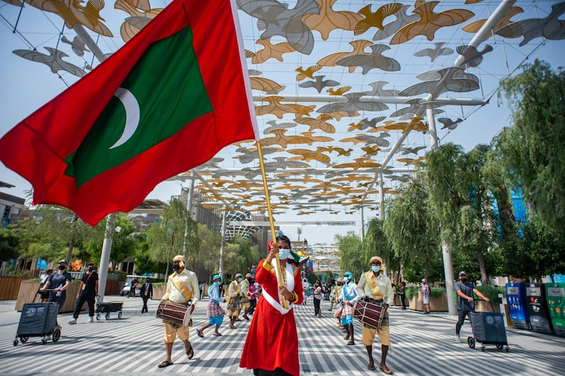 Flag-waving at the parade. Photo: Omar Marques / Expo 2020 Dubai