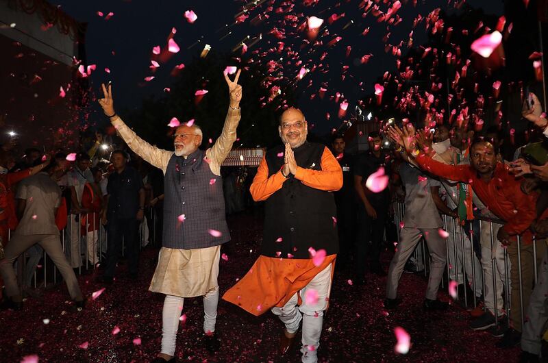 epa07596715 A handout photo made available by the Bharatiya Janata Party (BJP)Â showing (BJP) leader and Indian Prime Minister Narendra ModiÂ (L) and Bharatiya Janata Party (BJP) President, Amit Shah gestures a victory sign at the party headquarters in New Delhi, India, 23 May 2019.Â (issued 24 May 2019) The Lok Sabha, the lower house of Parliament, elections, which began on 11 April 2019, is having the results tallied on 23 May. The Lok Sabha elections were held for 542 of the 543 lower house seats, and a party or alliance needs 272 seats to form a government. According to the polling Narendra Modi could retain the position of Prime Minister along with the Bhartya Janta Party (BJP).  EPA/BHARATIYA JANATA PARTY HANDOUT  HANDOUT EDITORIAL USE ONLY/NO SALES