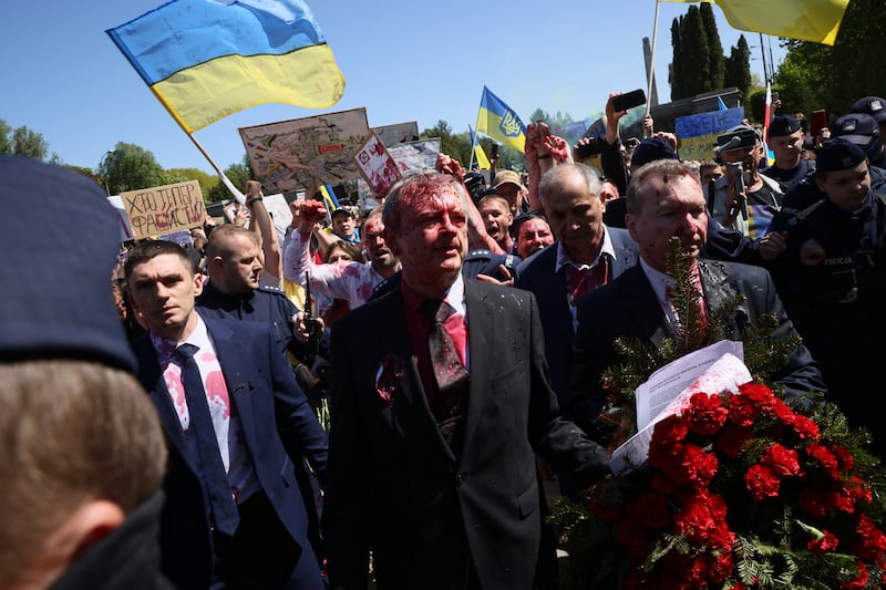 Russia's ambassador to Poland, Siergiej Andriejew, was doused  as he marked Victory Day at a cemetery. EPA