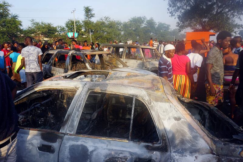 Cars were severely damaged in the explosion. AFP