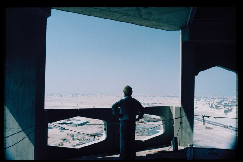 A consultant taking in the view from an unfinished balcony in Dubai World Trade Centre in 1977. Photo: John R Harris Library