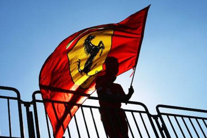 A Ferrari fan is seen in the grandstand during a practice session ahead of the Italian Grand Prix in Monza. The entire region, in this part of Italy, metamorphoses into a sea of scuderia red on the weekend.