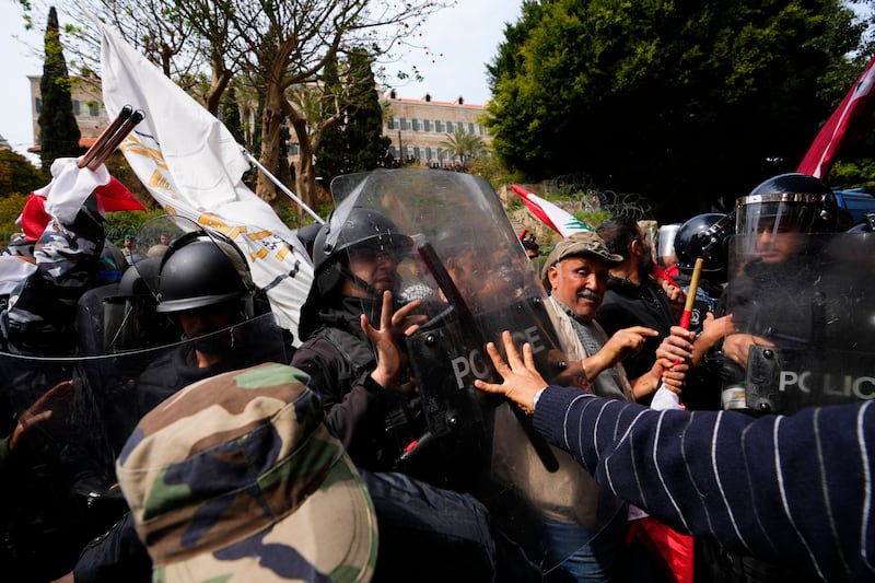 Lebanese veterans and police in a confrontation during the protest. AP