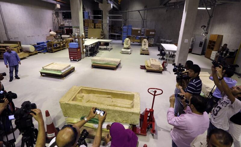 Cameramen film the stone laboratory of the restoration center at the partially opened complex of the Grand Egyptian Museum in Cairo. Amr Nabil / AP Photo