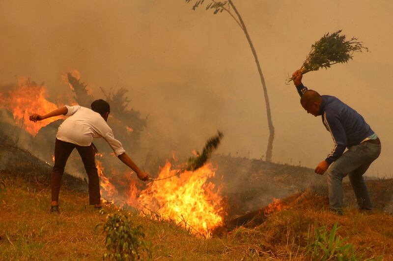 Residents battle a fire in Baglung, about 275 kilometres west of Kathmandu in Nepal. AFP